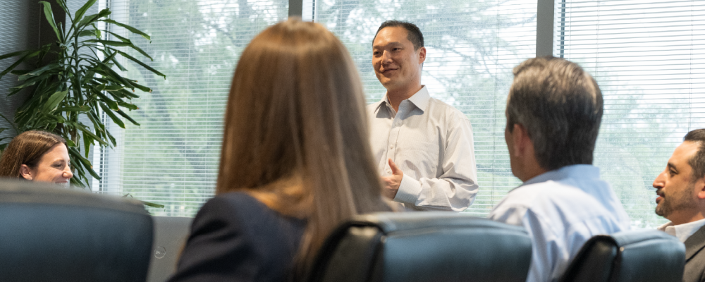 Man presenting to group of people