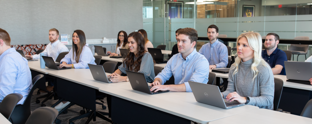 Sales team meeting in conference room.